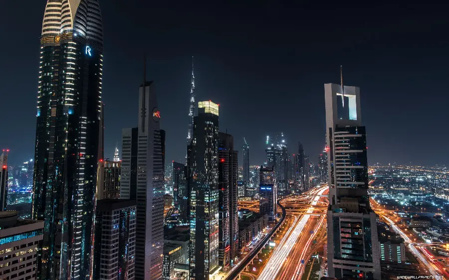 Dubai city skyline at night with soaring towers