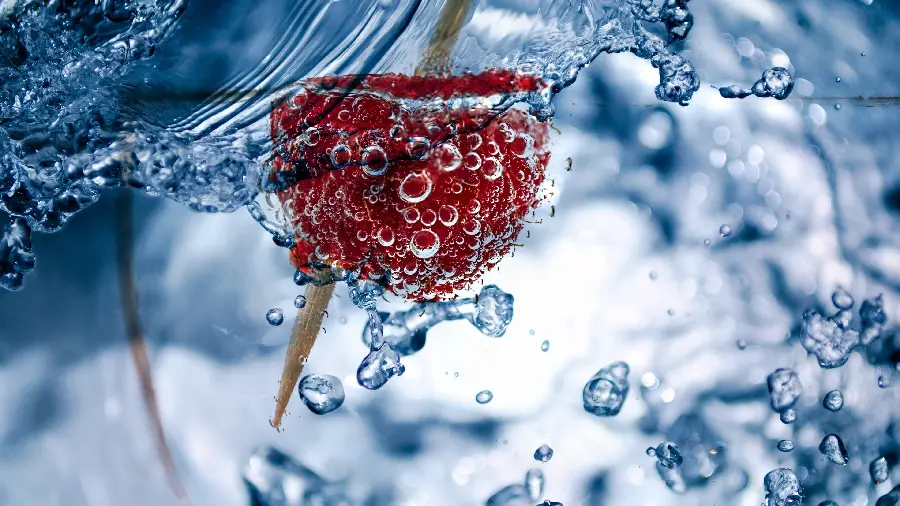 Beautiful wallpaper of delicious raspberries in water with wonderful color