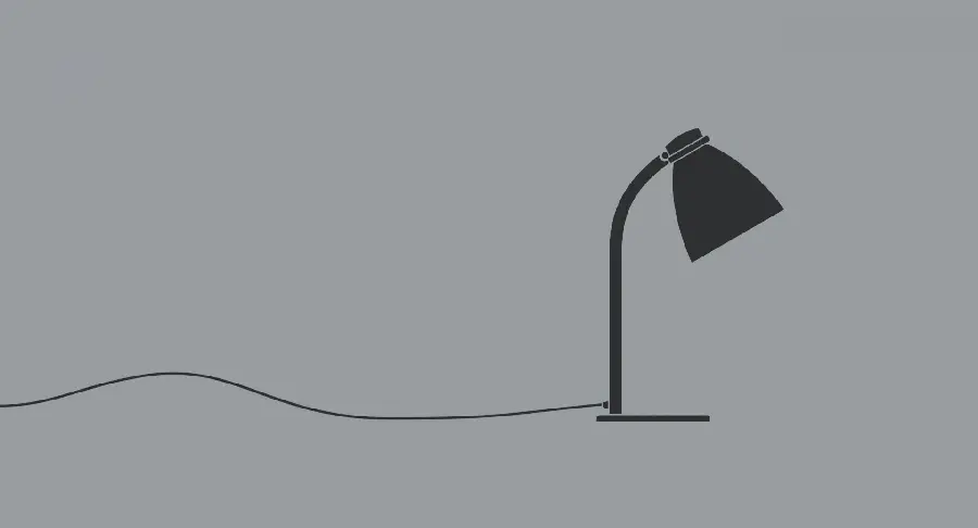 Minimalist gray background of a laptop reading lamp