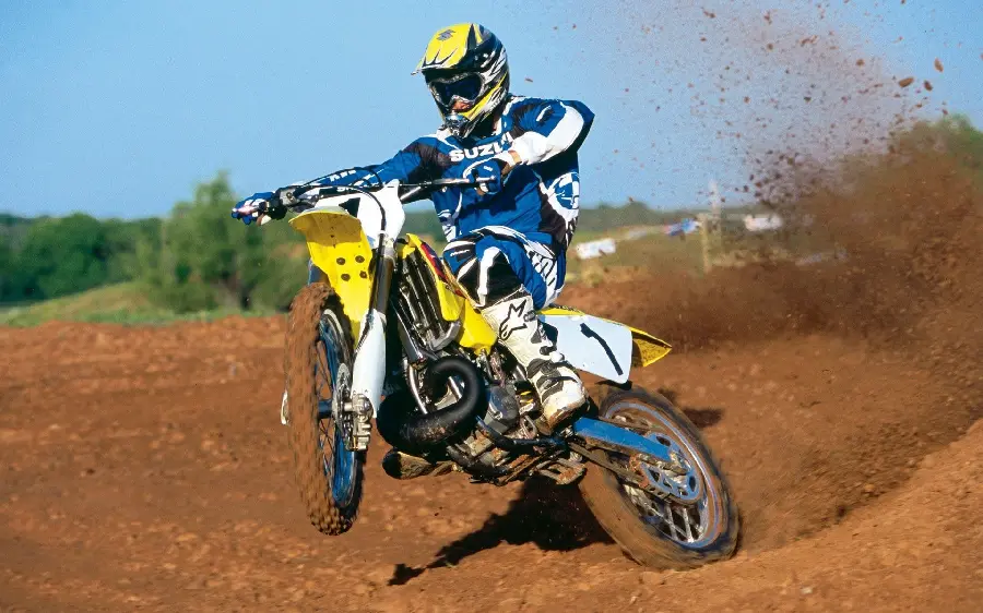 Photo of a motorcycle with a yellow trail on the track