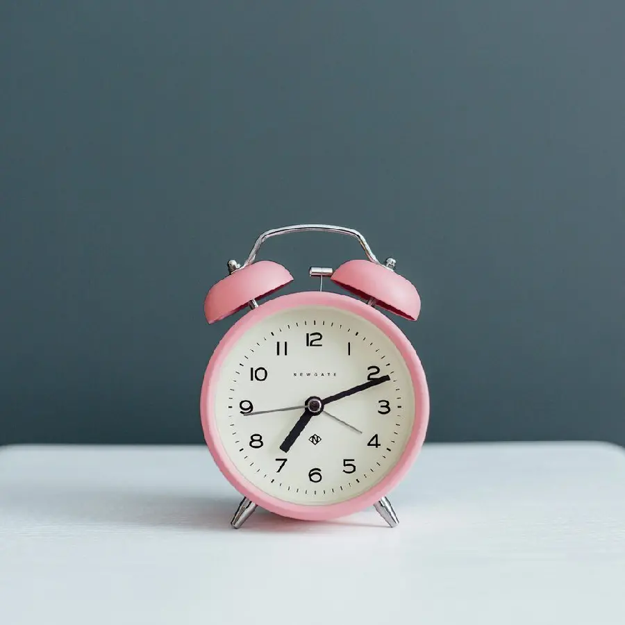 Interesting photo of a cute pink alarm clock