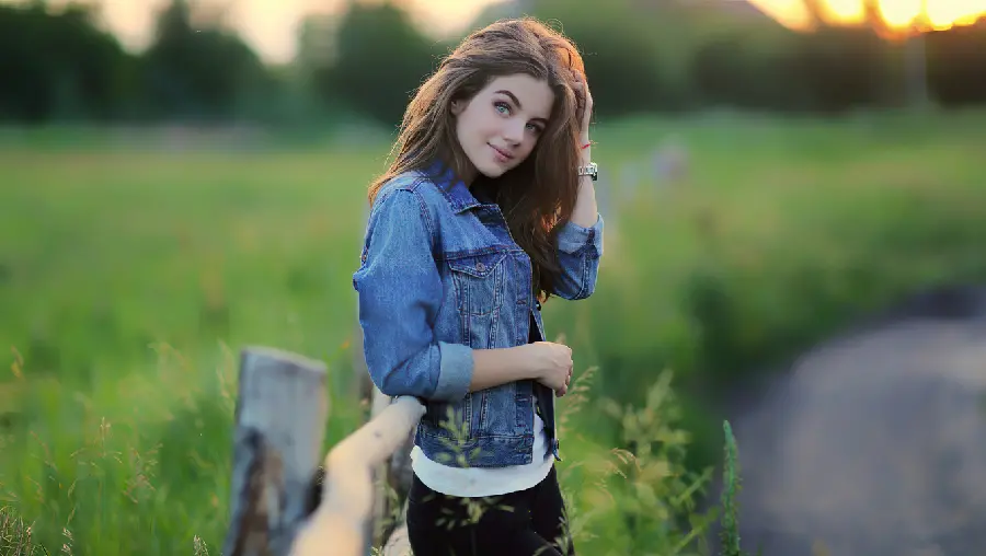 Photo of a foreign teenage girl in nature with bright blue eyes