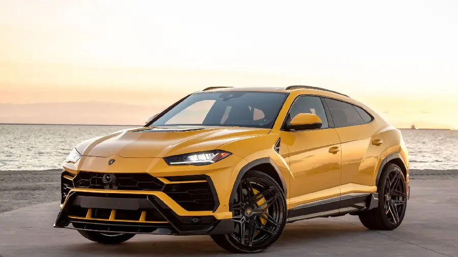 A wonderful picture of a Lamborghini SUV on the beach for your beautiful desktops