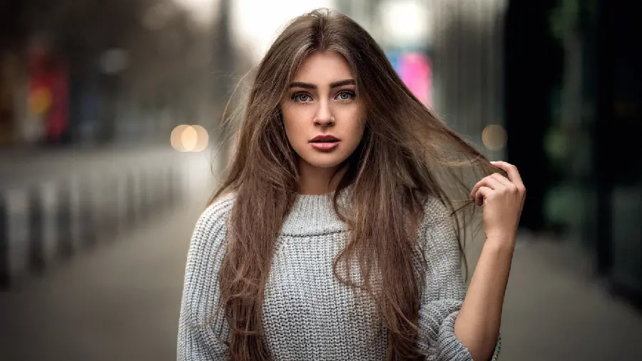Profile photo of a beautiful and oppressed foreign girl with long silky hair