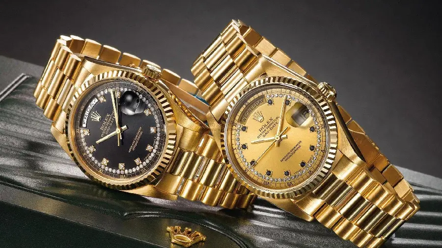 A very beautiful photo of a valuable Rolex Oyster Perpetual Day Date men's and women's set made with yellow gold and real diamonds