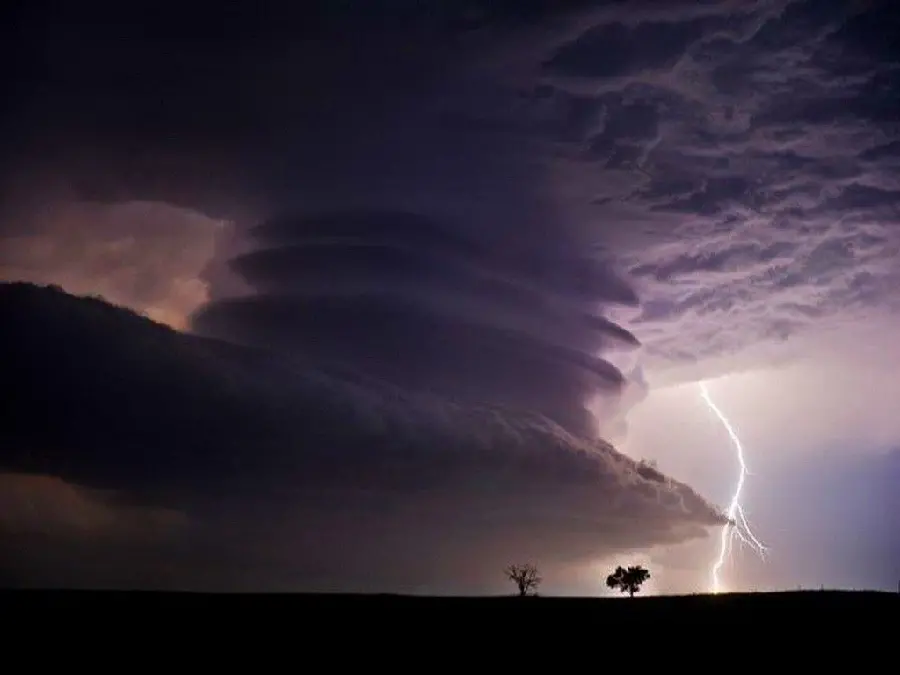 Stunning background of the largest tornado in the purple sky