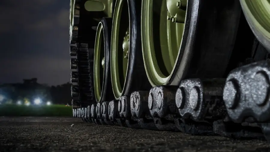 Special view of the wheels of a green monster tank for a profile