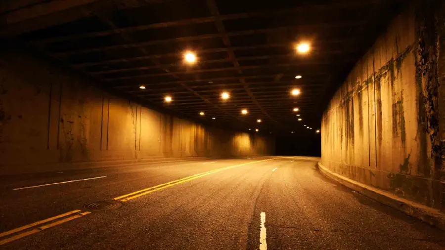The latest profile photo of the tunnel with bright lights at night