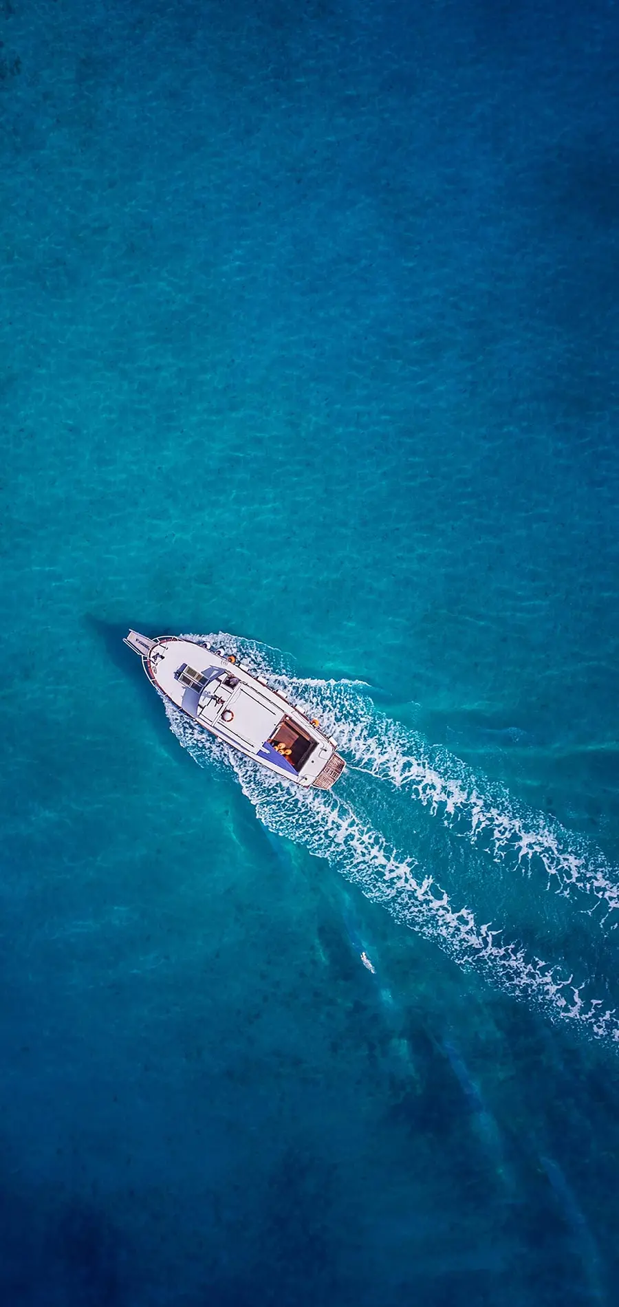 High quality mobile phone background of a boat by the sea