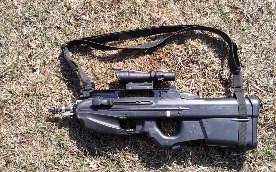 Photo of a strange small black gun and rifle