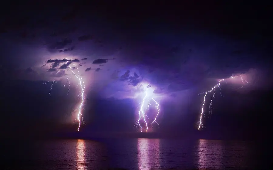 Beautiful interesting background of three beautiful lightnings in the sky