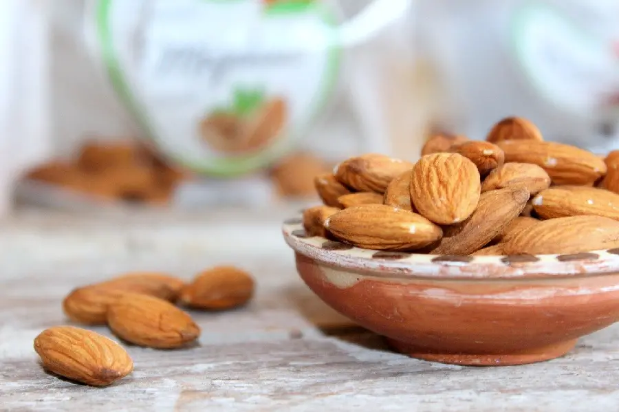 4K Image of Brown Almonds in a Stylish Bowl