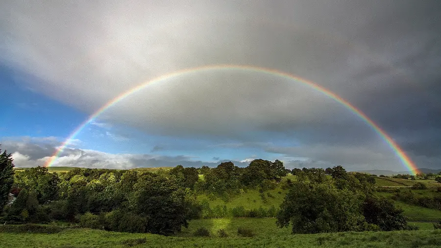 HD wallpaper of a crescent rainbow in spectacular nature