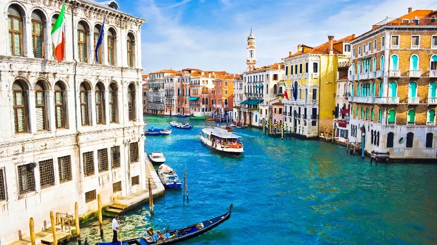 Venice canals with colorful boats and wonderful buildings