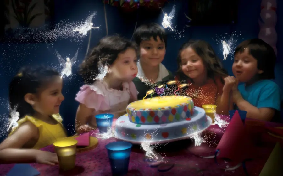 Dreamy picture of a children's birthday party next to beautiful luminous angels