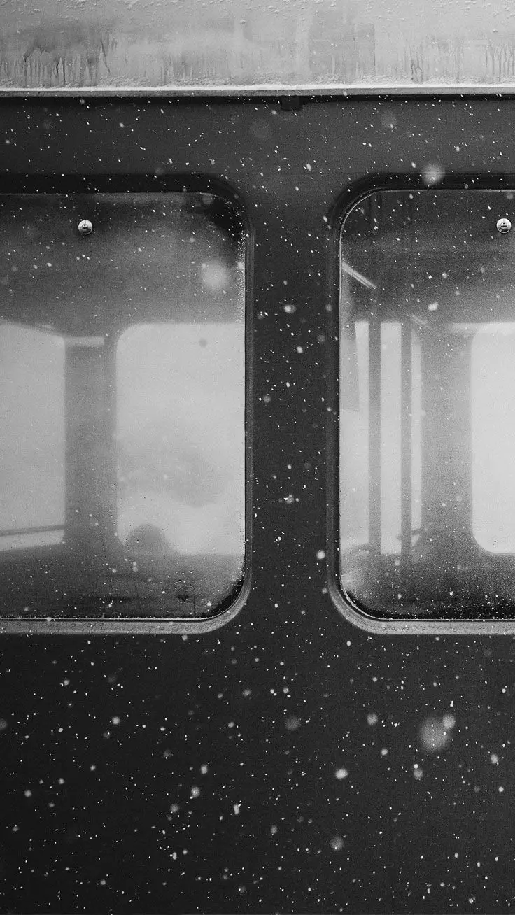 Dreamy phone background photo with a train window design in the snow