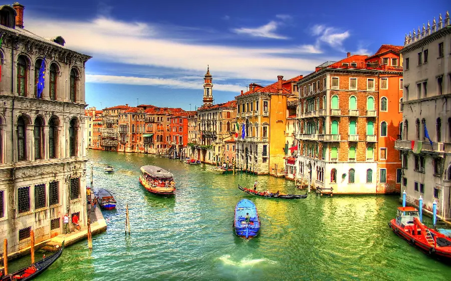 Photo of Venice canals with colorful boats