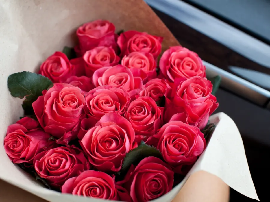 HD view of a beautiful luxurious red rose bouquet in a car