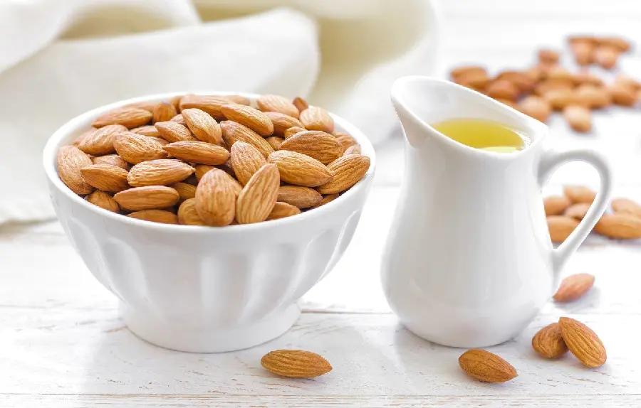 A spectacular artistic image of almonds and almond oil