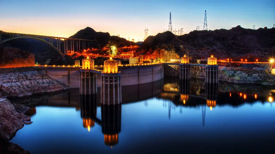 A bright and brilliant photo of a beautiful blue dam in the heart of nature
