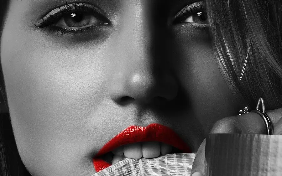 Ana de Armas's attractive black and white profile photo with bright red lipstick