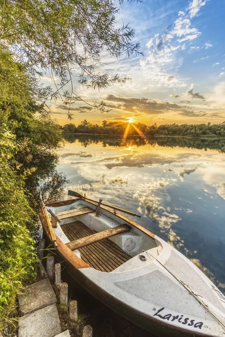 Soothing wallpaper of a boat moored by the lake for relaxation