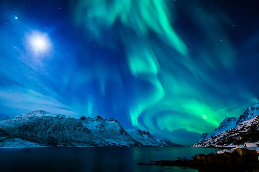 Glorious wallpaper of the blue-green Scandinavian sky with Northern Lights	