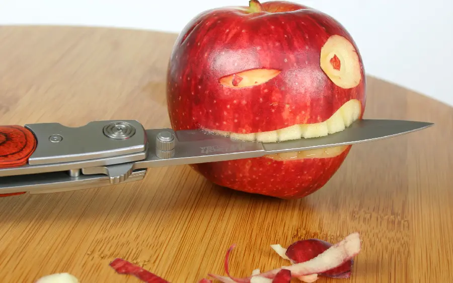 Fantasy image of a red apple cut into the shape of a human