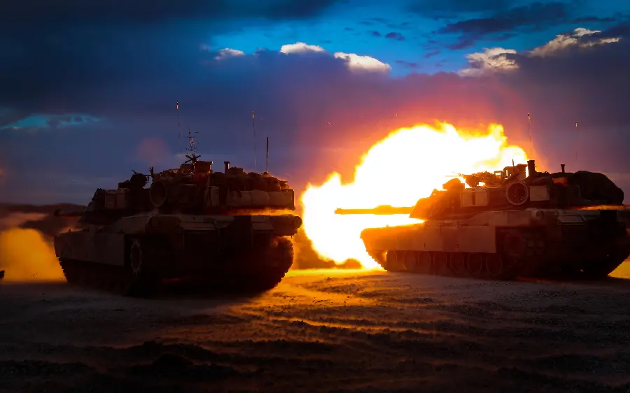 High quality stock photo of a battle tank firing a cannon at night
