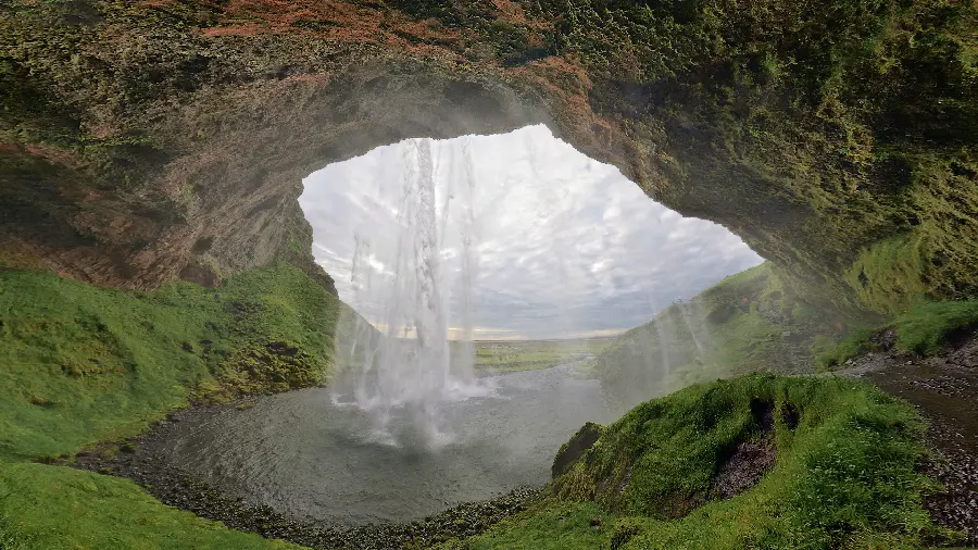 A brilliant image of a spring inside a lush cave for poster printing