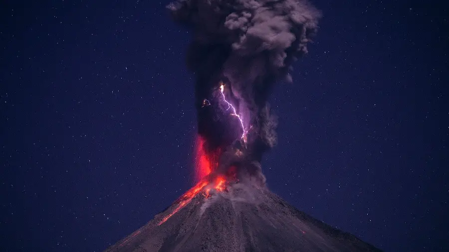 The creepy profile picture of the volcanic eruption and lightning in the starry night