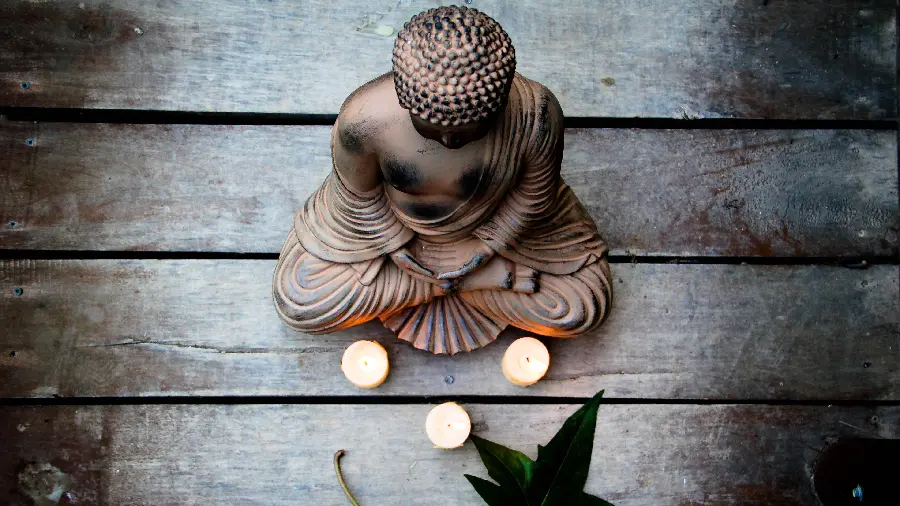 Free Download Photo of a Buddha Statue and Several Candles in a Tibetan Temple