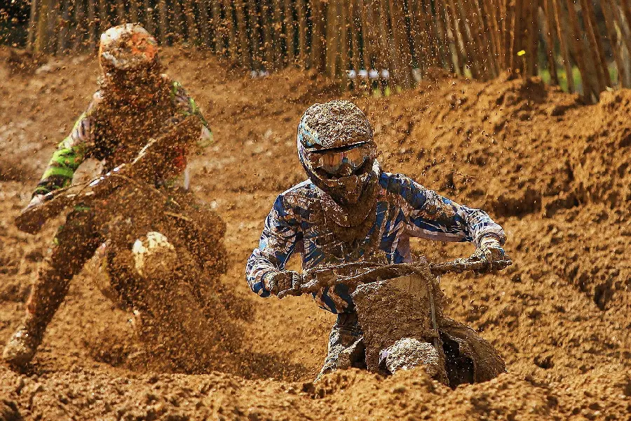 Photo of a motorcycle competition in the mud