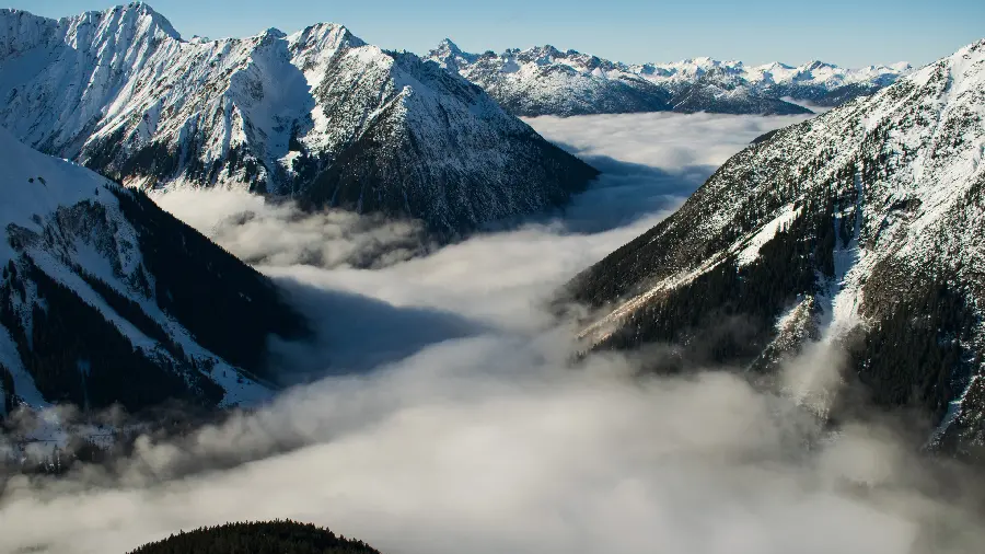 Beautiful story of snowy mountains among clouds suitable for instagram 