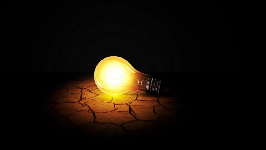 High-quality conceptual background of a light bulb in the dark