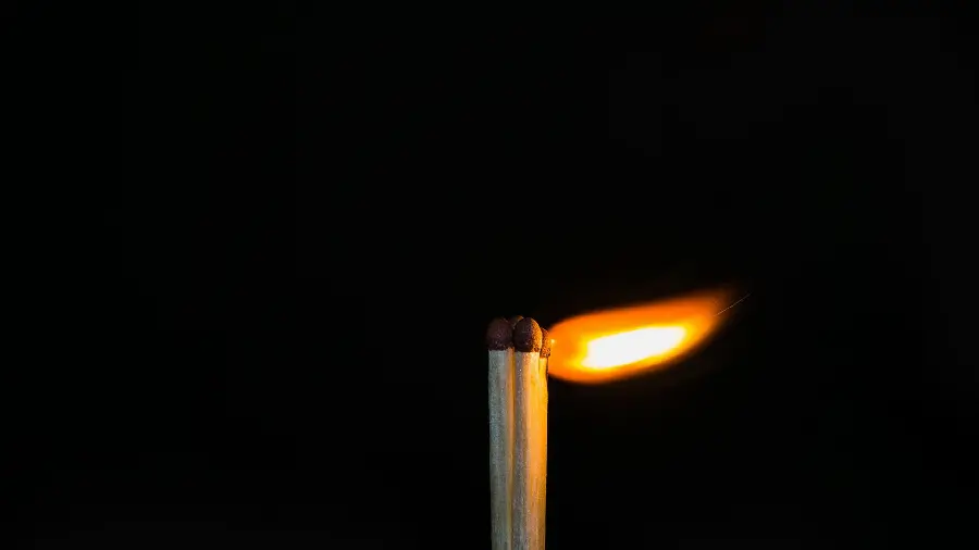 Unique Wallpaper of Bright Matches with a Black Background