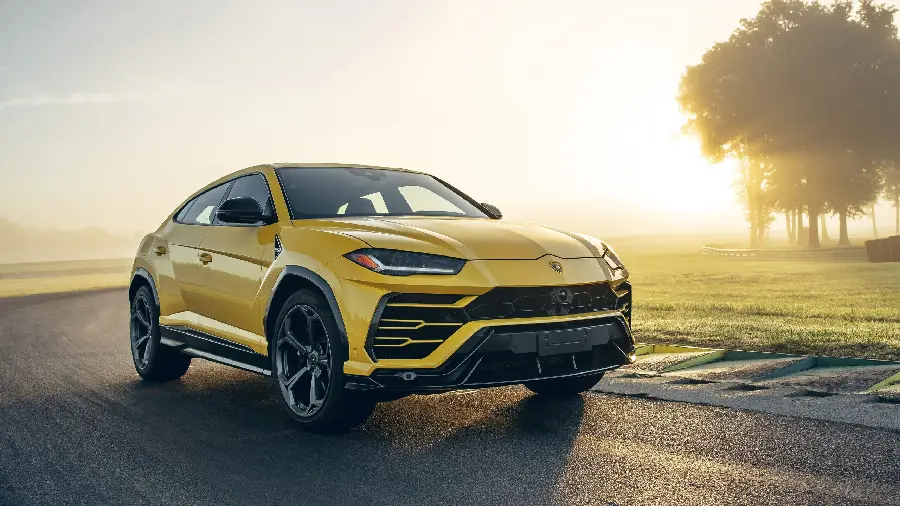 Yellow Lamborghini SUV in a very beautiful sunset with full HD quality