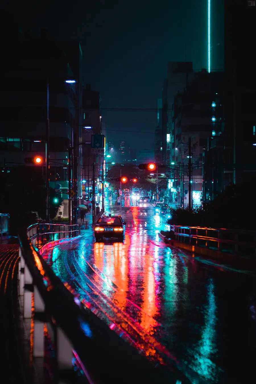 Lonely street of the big city with colorful lights shining