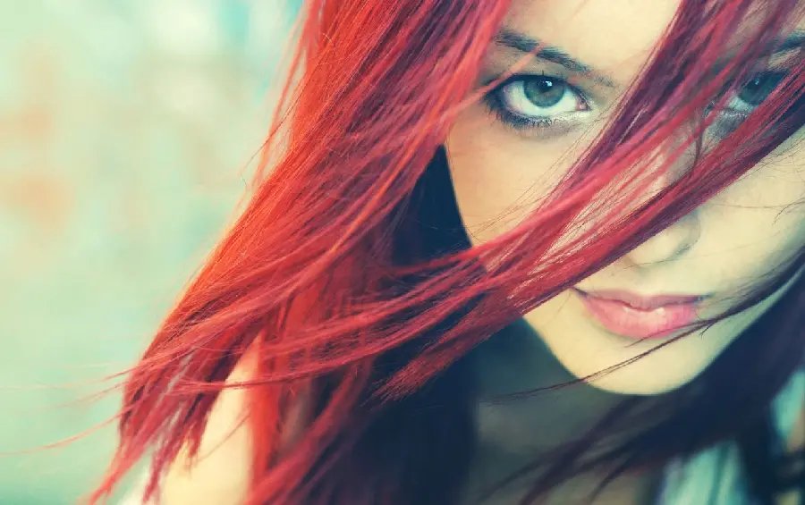 Profile of a beautiful red-haired girl with a charming look for Instagram