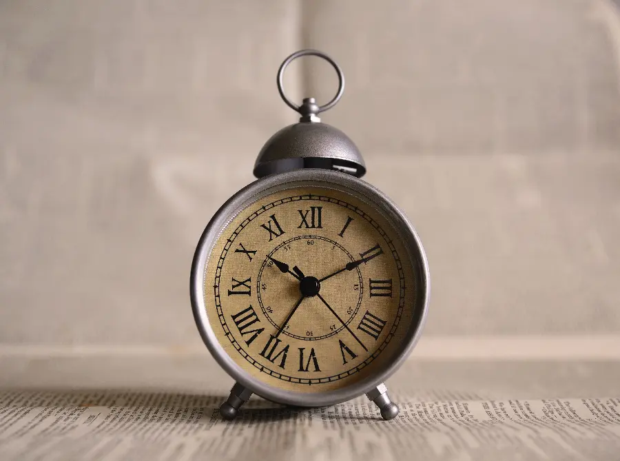 Conceptual photo of a metal alarm clock for profile 1402