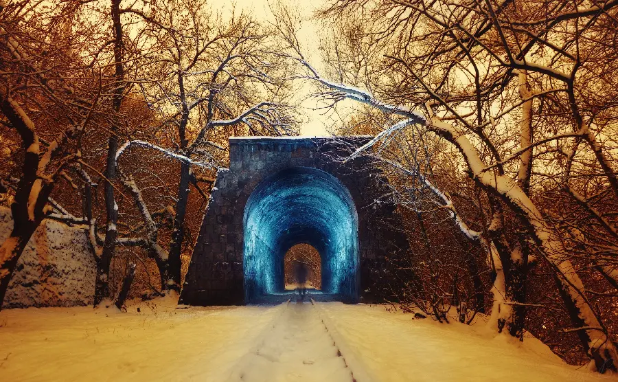 Amazing Scenery of Shiny Blue Snow Tunnel in Winter Forest