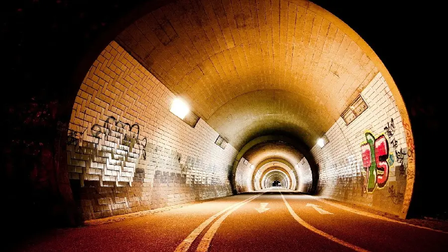 New and conceptual laptop wallpaper of a long tunnel illuminated at night