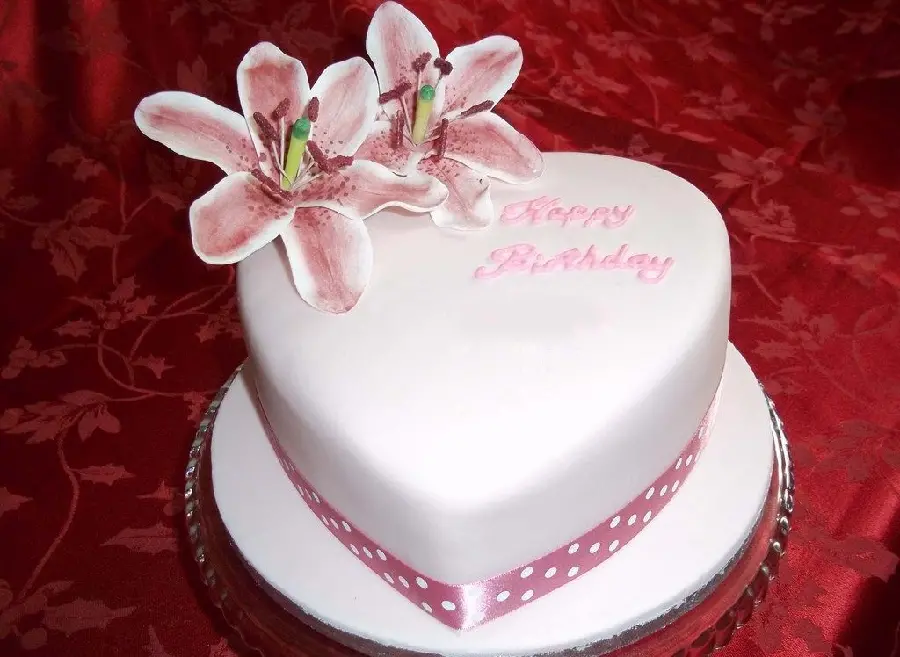 A beautiful heart-shaped birthday cake in a beautiful frame for a 2023 profile