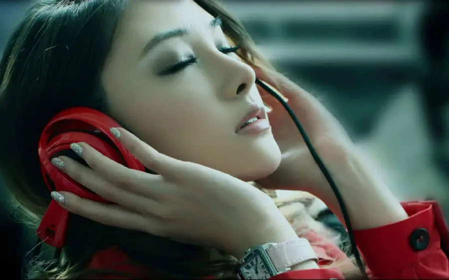 Beautiful and stylish girl's photo with red headphones for music lovers' profiles