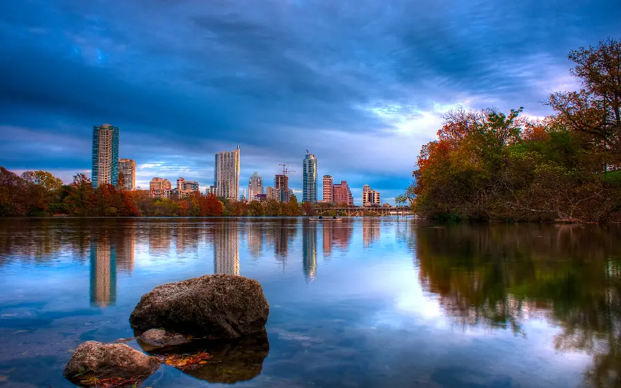 Beautiful background of the reflection of the city with tall buildings in the water in full hd quality