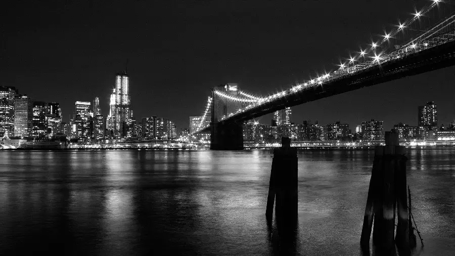 Artistic photo of the famous Brooklyn Bridge at night for Instagram post