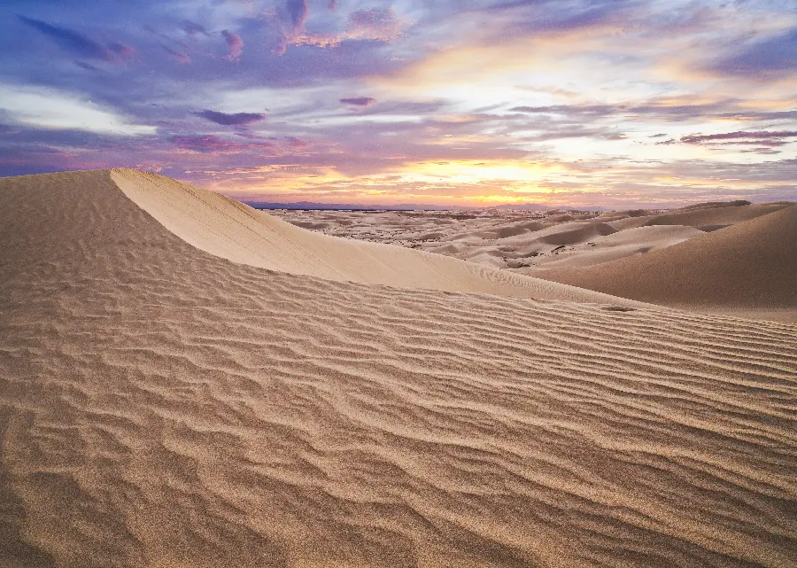 Magical nature photo of the Yazd desert under the purple and orange sunset sky