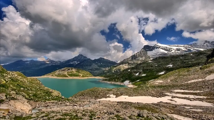 Download the spectacular view of the lake from the high hills under the beautiful cloudy sky