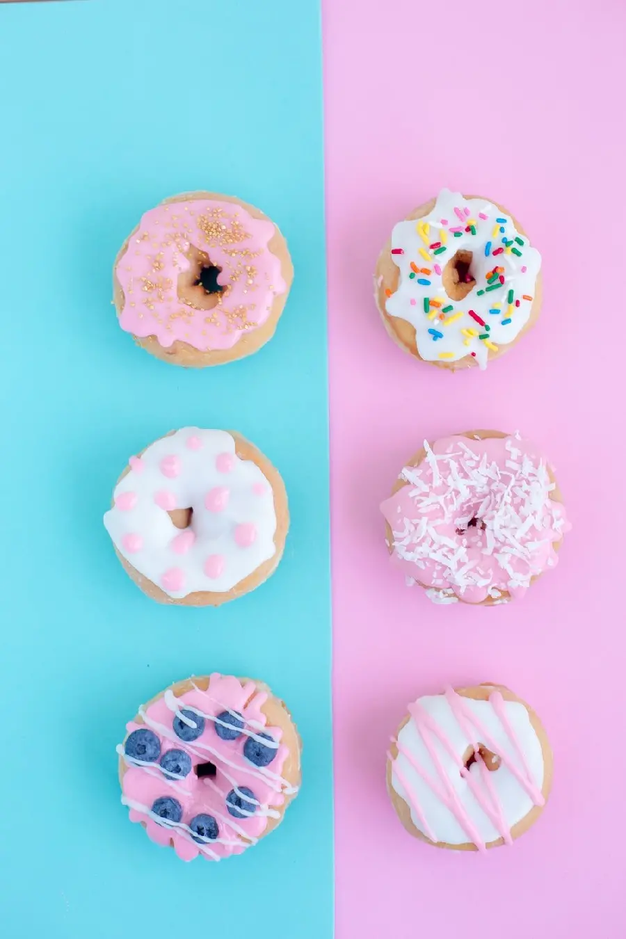 Delicious colorful donuts on a beautiful blue and pink screen