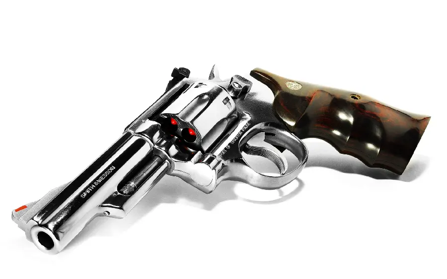 Gun profile photo and beautiful photo of a revolver on a white background